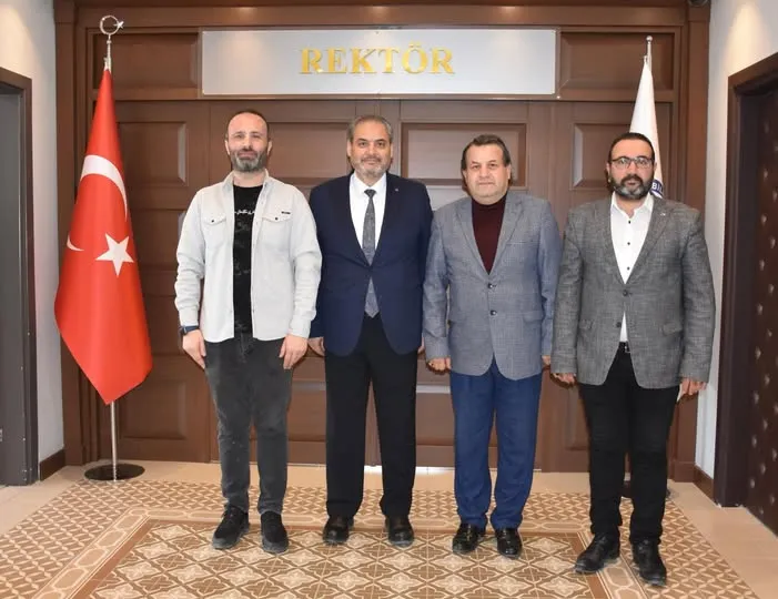 AFSÜ Rektörü, AFİHAD Idareini Makamında Onayladı